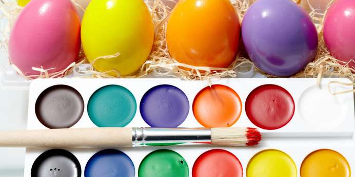close-up-of-watercolors-with-painting-brush-and-easter-eggs-near-by-SBI-305705005-min.jpg